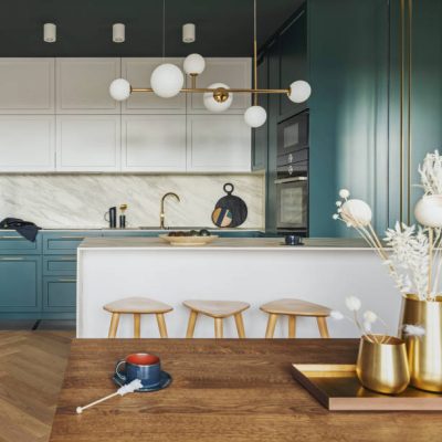 Luxury modern and vintage turquoise interior. Marble kitchen island with wooden chockers. Brown wooden table with metalic tray and metalic gold vase with white decorations.
